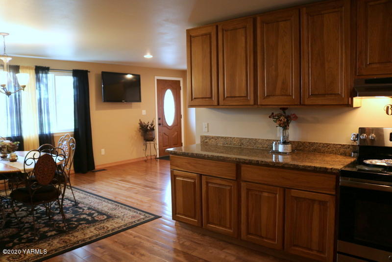 2491 Lateral 1 Road Wapato, WA 98951 - Photo 6 of 26 a kitchen with wooden cabinets and a sink