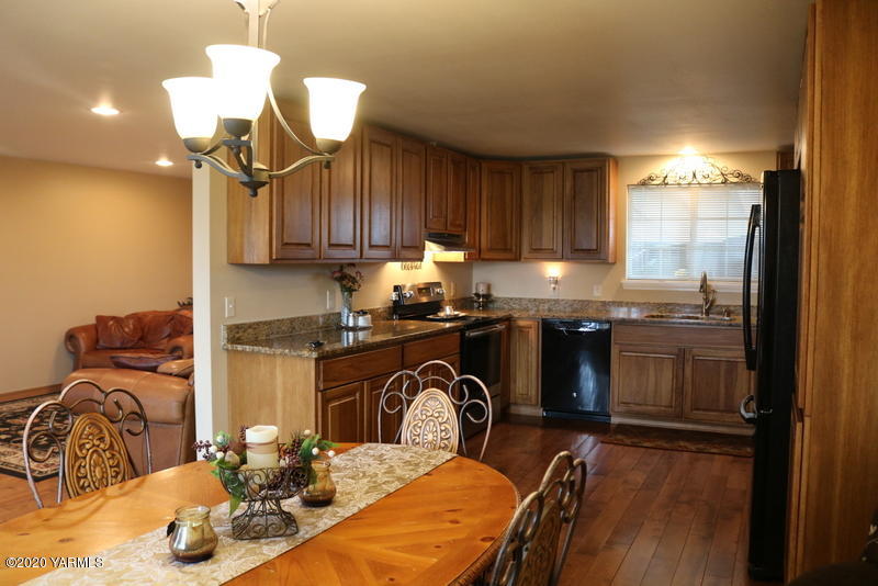 2491 Lateral 1 Road Wapato, WA 98951 - Photo 8 of 26 a kitchen with granite countertop a sink and a stove