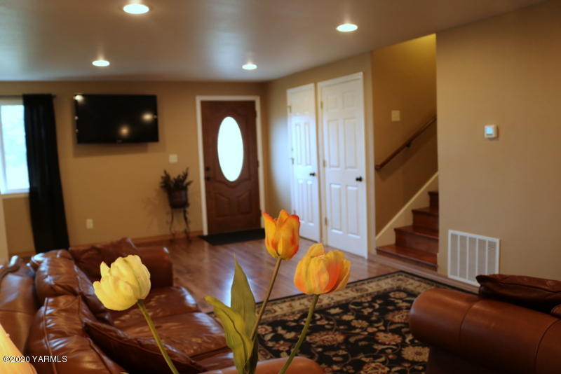 2491 Lateral 1 Road Wapato, WA 98951 - Photo 10 of 26 a living room with furniture and a wooden floor