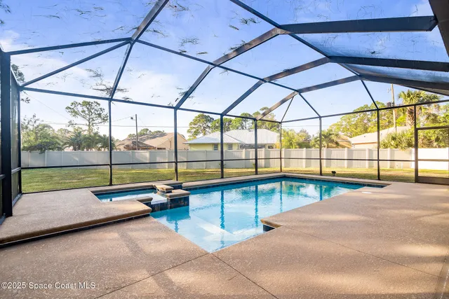 a view of a swimming pool with a porch