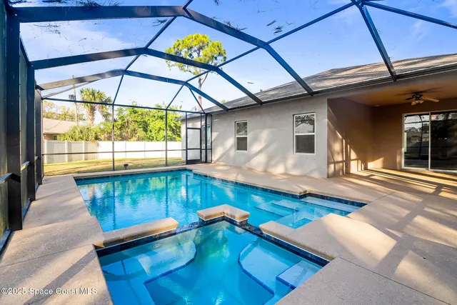 a living room with pool table and a dining table