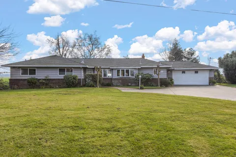 a view of a house with a swimming pool