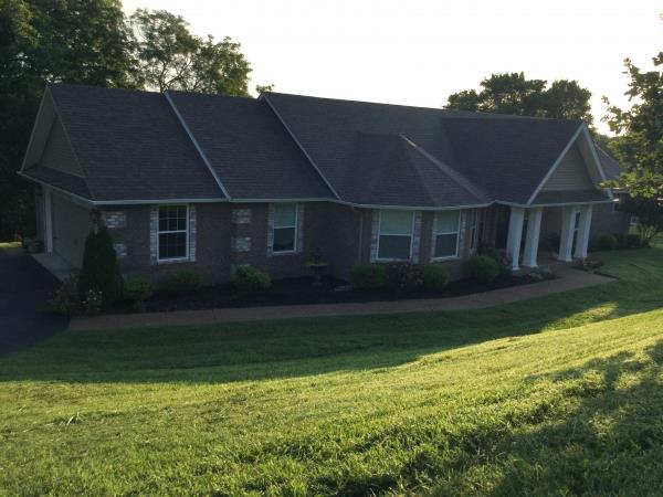 1520 Heller Ridge Spring Hill, TN 37174 - Photo 3 of 21 a front view of house with yard and green space