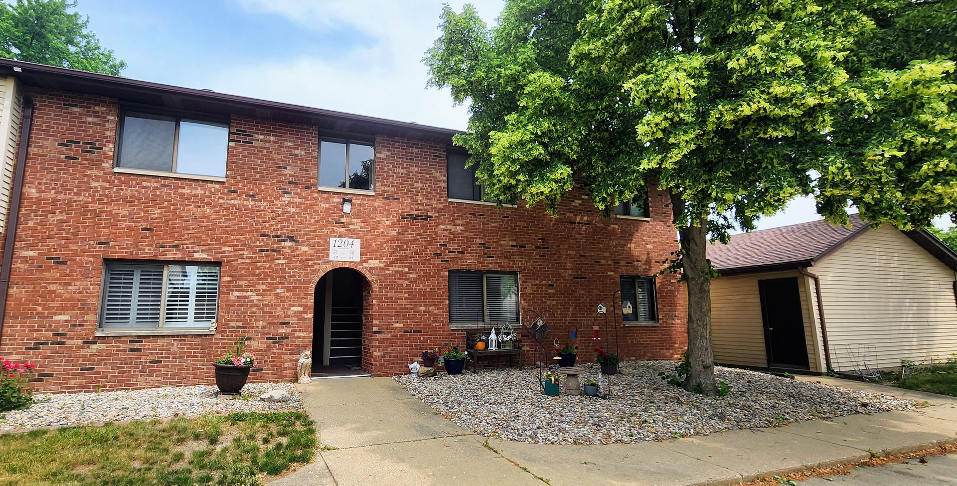 a front view of a house with yard