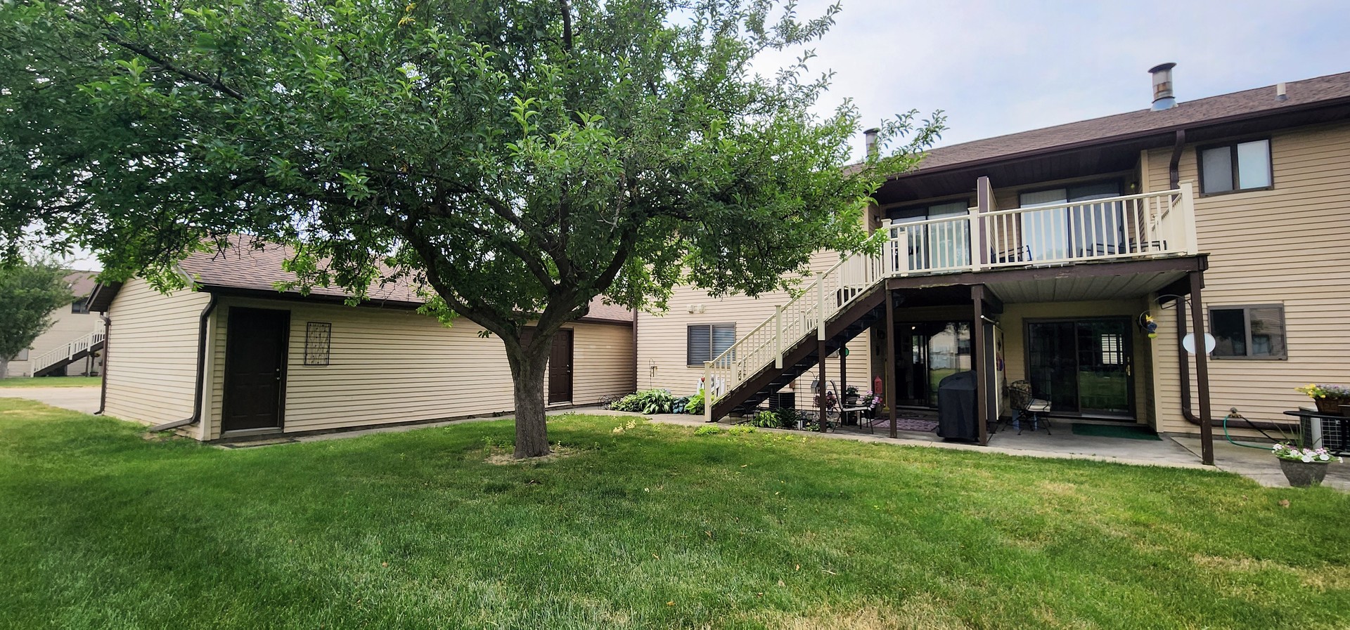 1204 Dean Drive, Unit 4 Urbana, IL 61802 - Photo 13 of 15 a view of an house with backyard and a tree