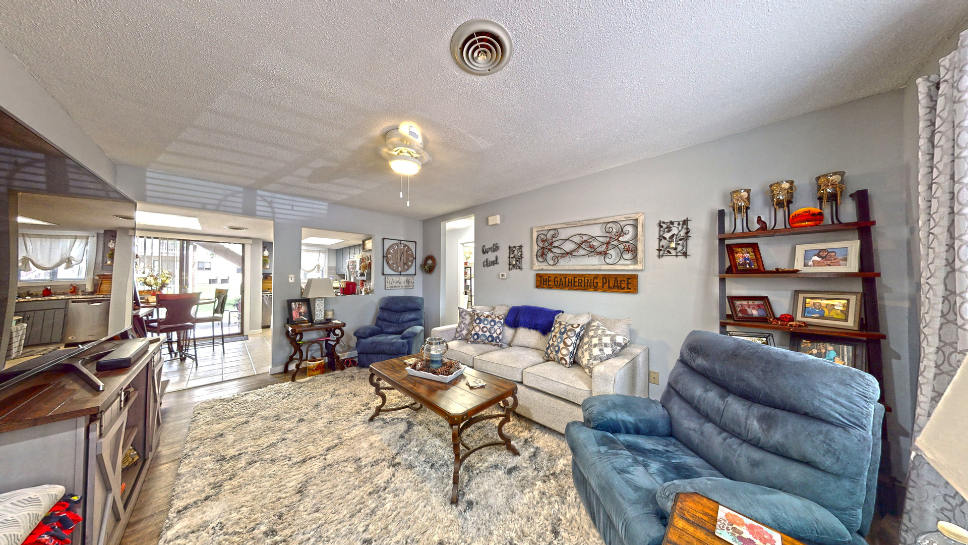 1204 Dean Drive, Unit 4 Urbana, IL 61802 - Photo 2 of 15 a living room with furniture a couch and paintings on the wall