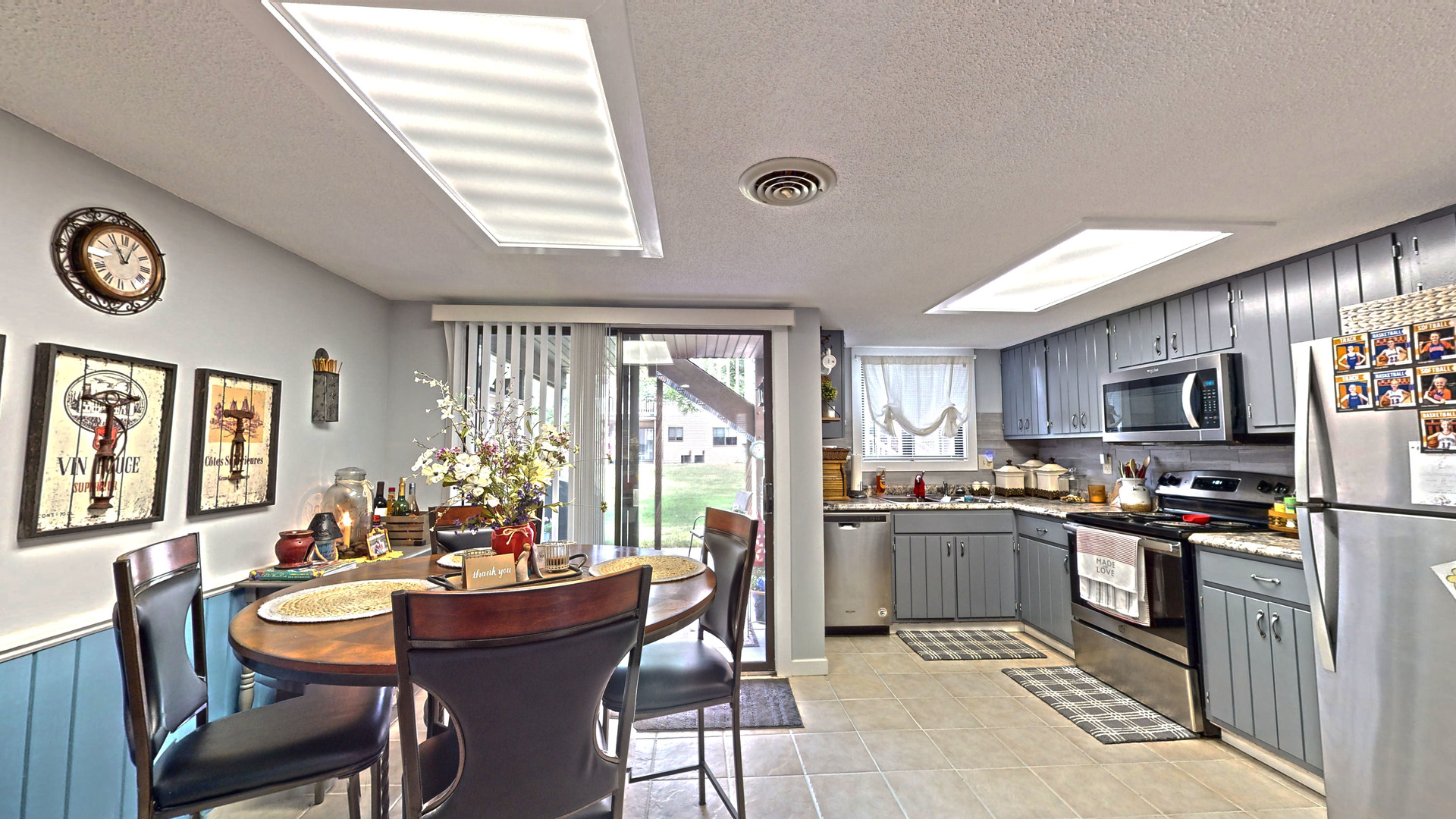 1204 Dean Drive, Unit 4 Urbana, IL 61802 - Photo 4 of 15 a kitchen with kitchen island granite countertop a sink and stainless steel appliances