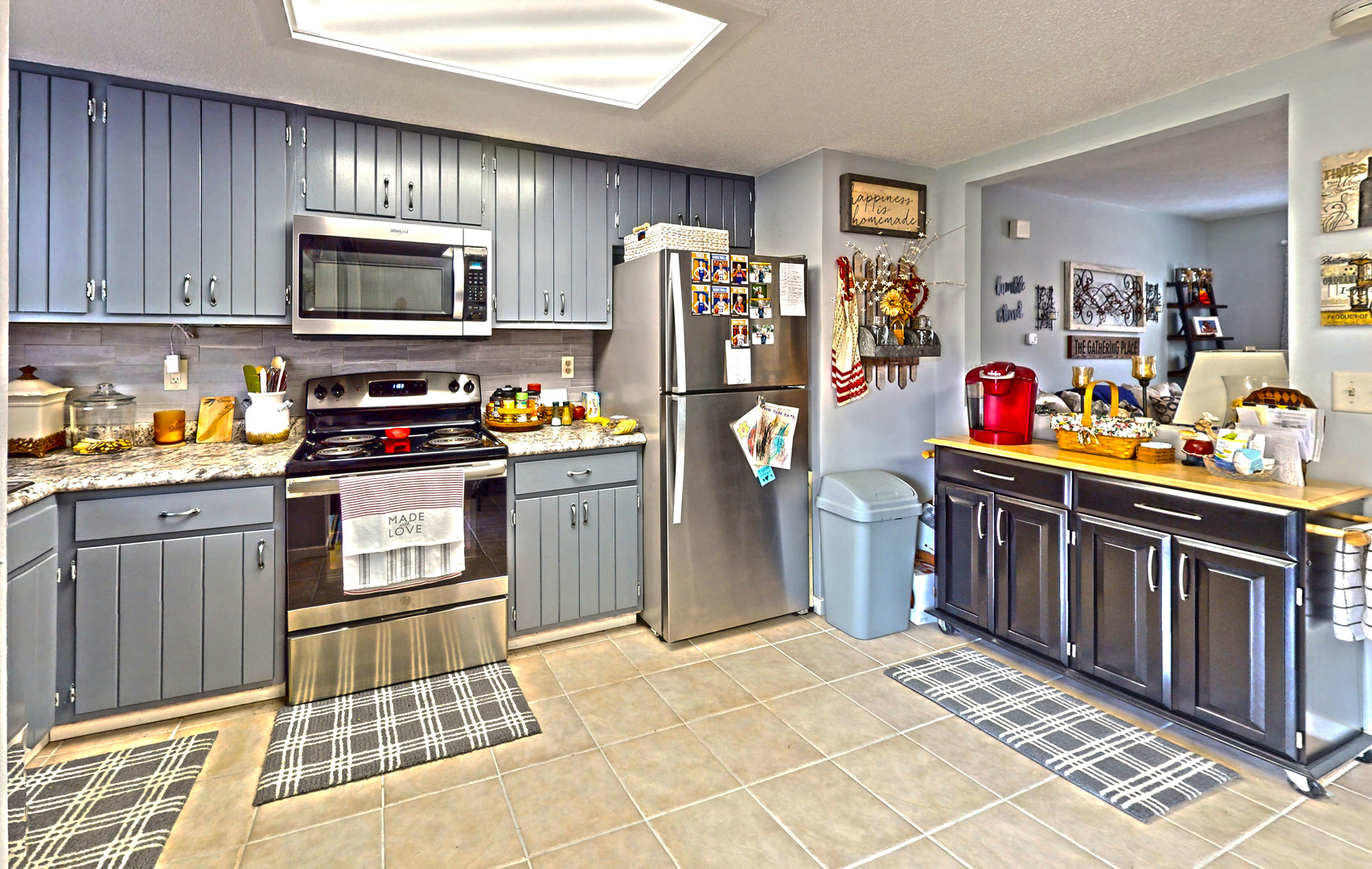 1204 Dean Drive, Unit 4 Urbana, IL 61802 - Photo 6 of 15 a kitchen with stainless steel appliances a stove top oven a refrigerator and cabinets