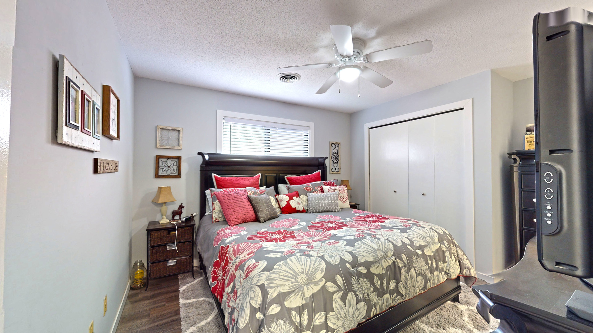 1204 Dean Drive, Unit 4 Urbana, IL 61802 - Photo 7 of 15 a bedroom with a large bed and a chandelier