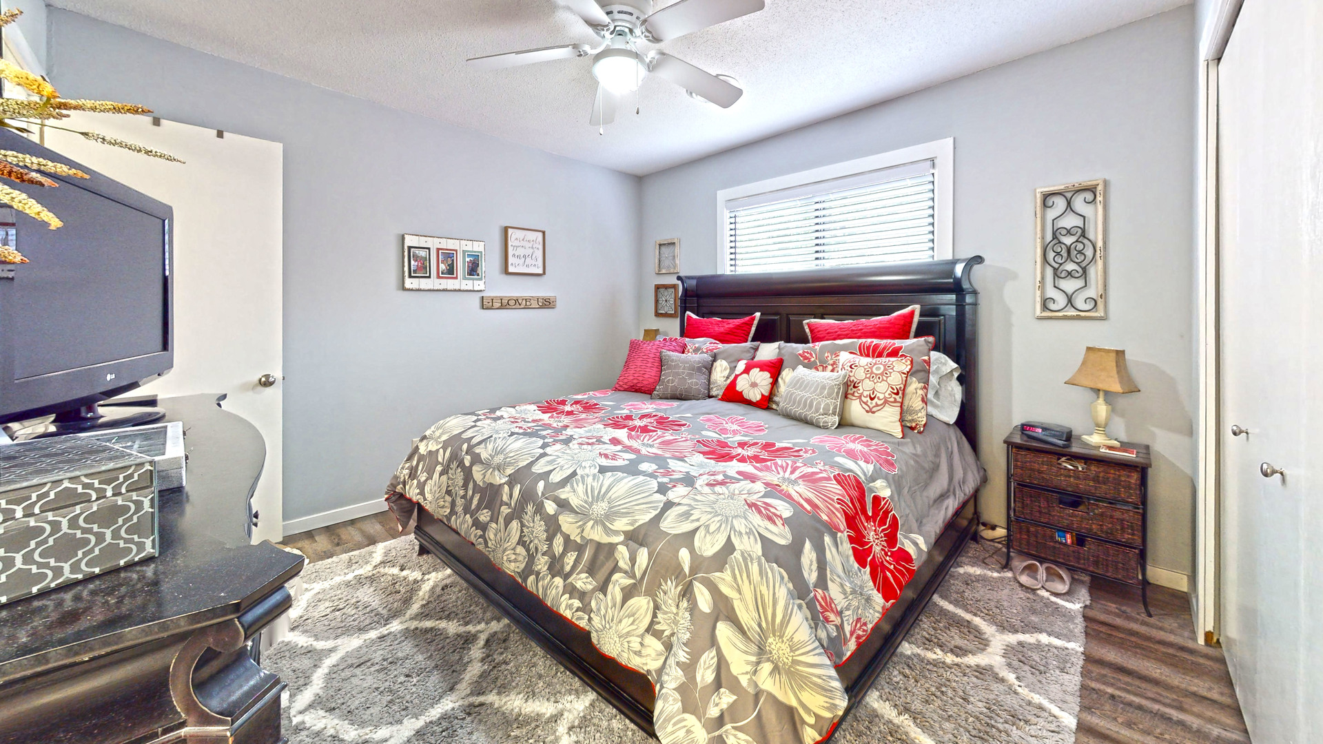 1204 Dean Drive, Unit 4 Urbana, IL 61802 - Photo 8 of 15 a bedroom with a bed and a chandelier