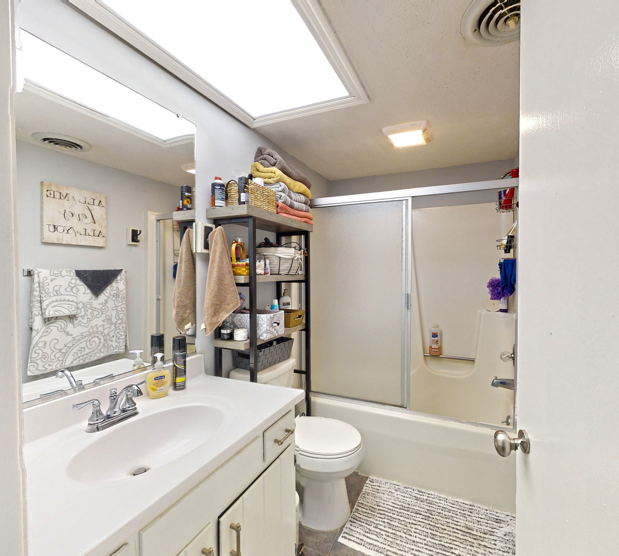 1204 Dean Drive, Unit 4 Urbana, IL 61802 - Photo 9 of 15 a bathroom with a sink toilet and shower