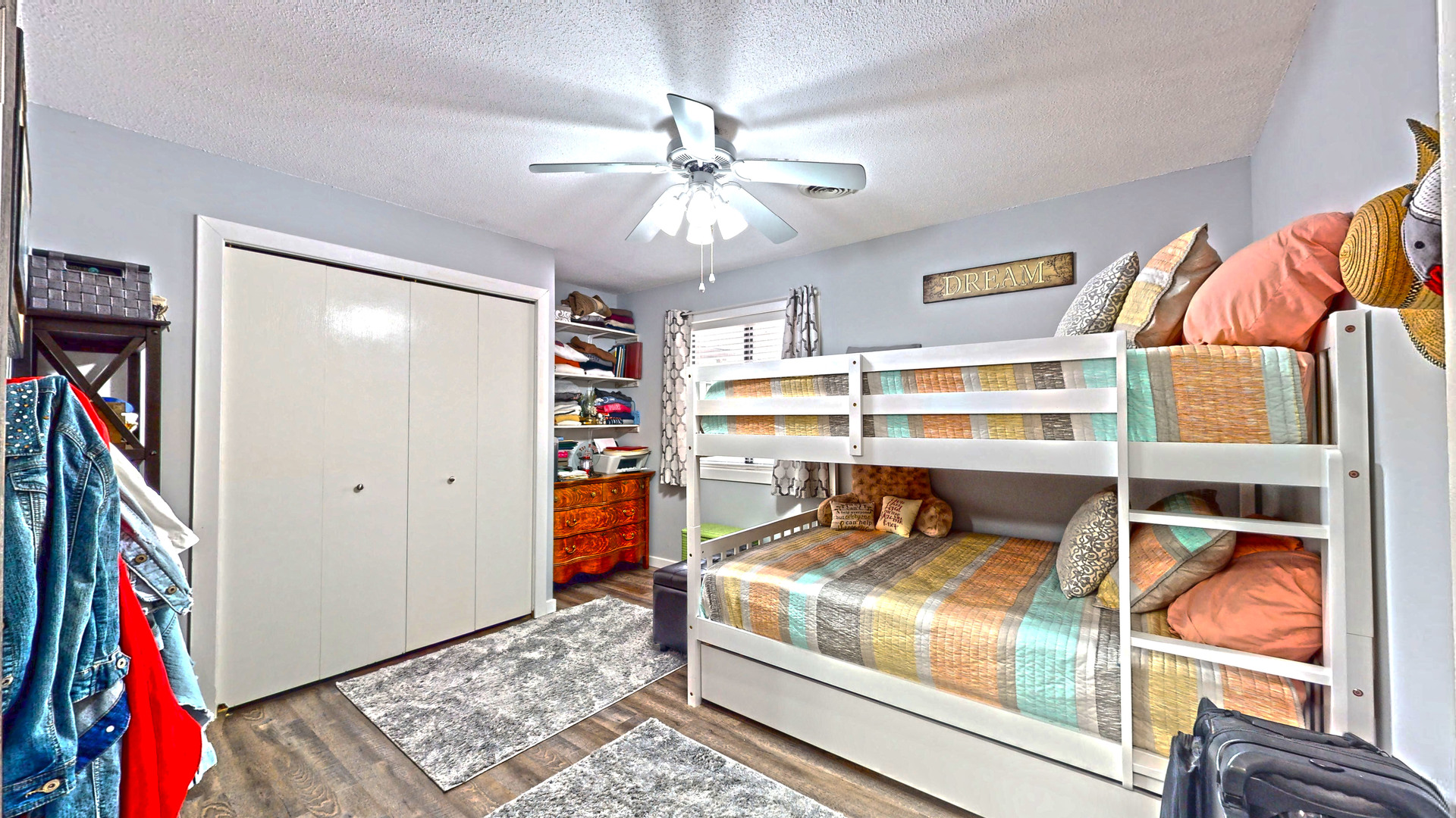 1204 Dean Drive, Unit 4 Urbana, IL 61802 - Photo 10 of 15 a bedroom with a bed and a chandelier