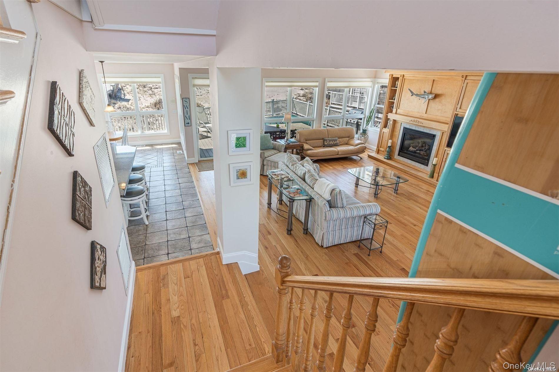 953 B Dune Road Westhampton Beach, NY 11978 - Photo 14 of 36 a living room with furniture and a flat screen tv