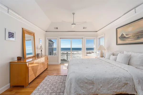 a large bedroom with a large bed and a large window