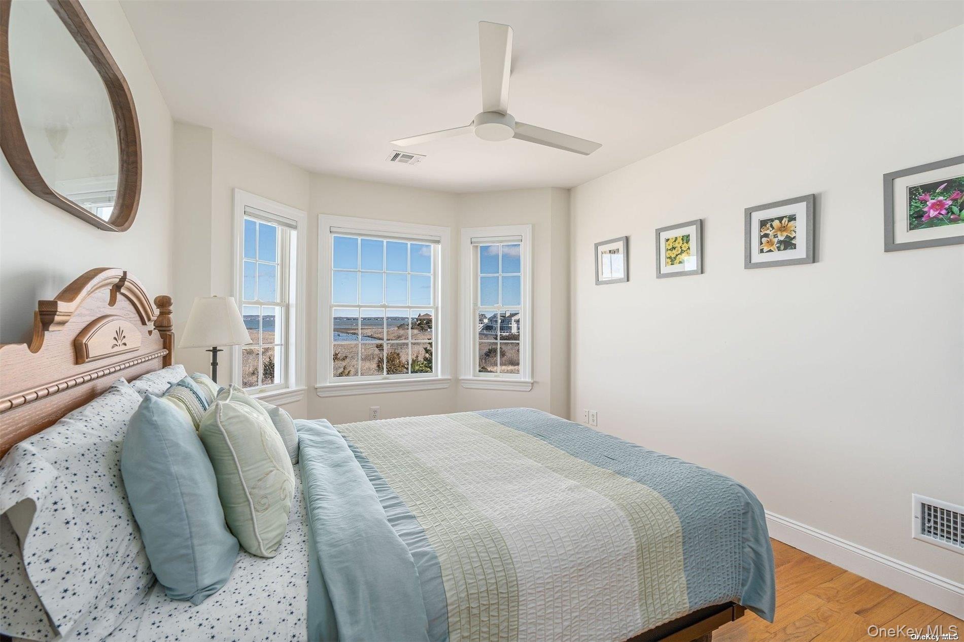 953 B Dune Road Westhampton Beach, NY 11978 - Photo 22 of 36 a bedroom with a bed and a window