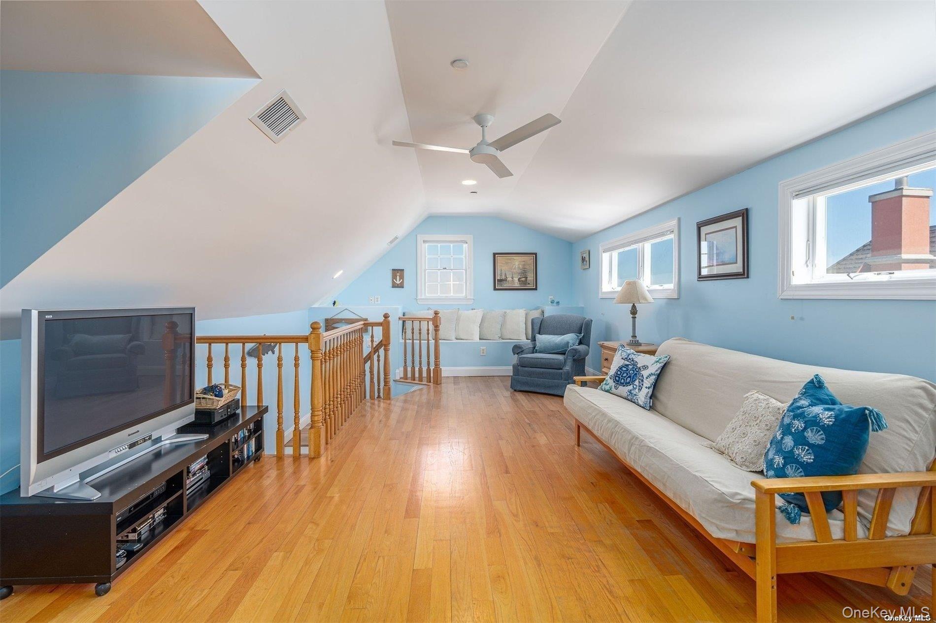 953 B Dune Road Westhampton Beach, NY 11978 - Photo 25 of 36 a living room with furniture and a flat screen tv