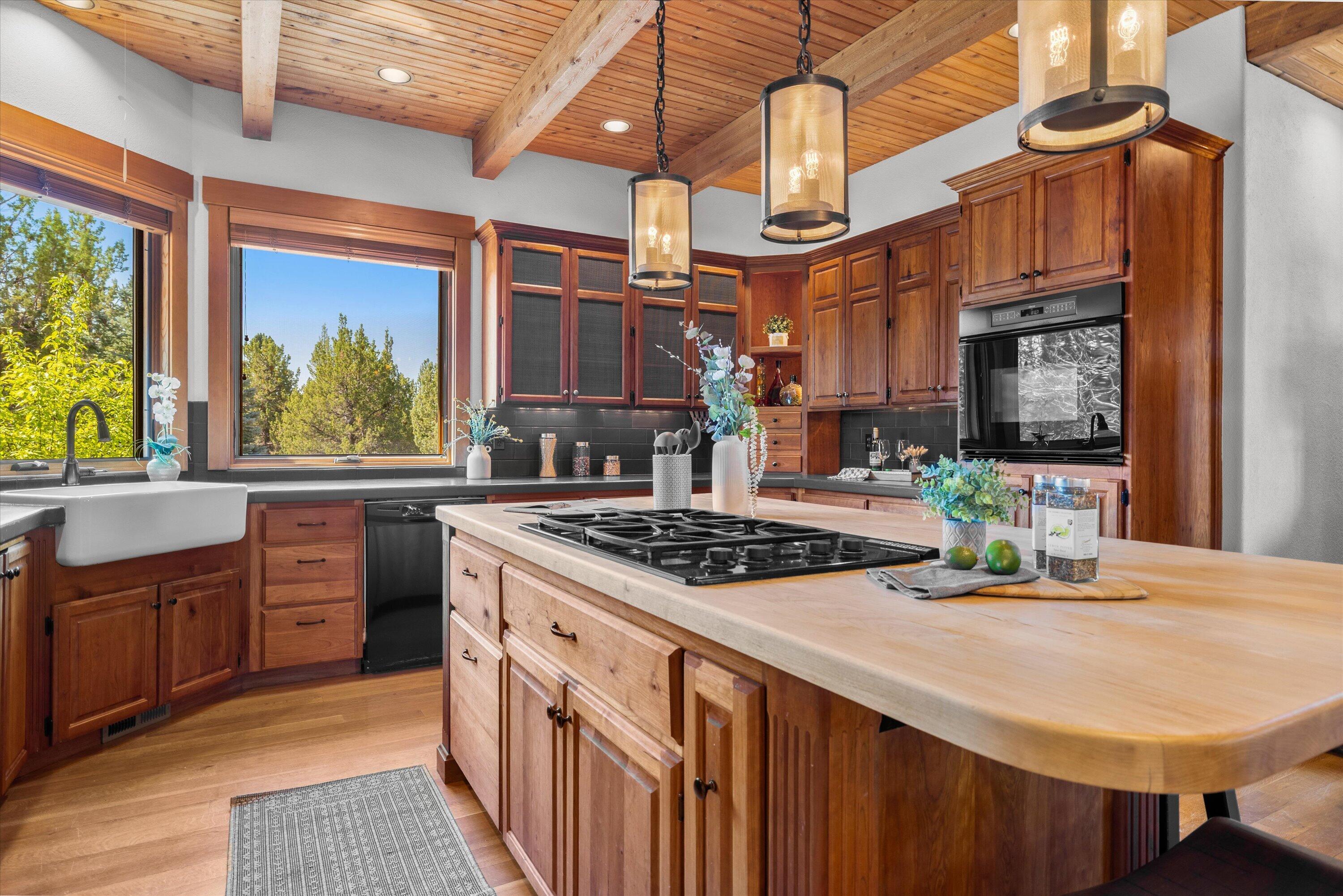 64155 Hunnell Road Bend, OR 97703 - Photo 23 of 96 Built for real life with large butcher block island and abundant storage.