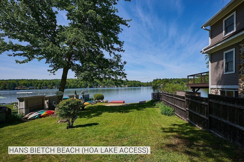 Lot 31 Wendell Road Shutesbury, MA 01072 - Photo 11 of 13 a backyard of a house with table and chairs