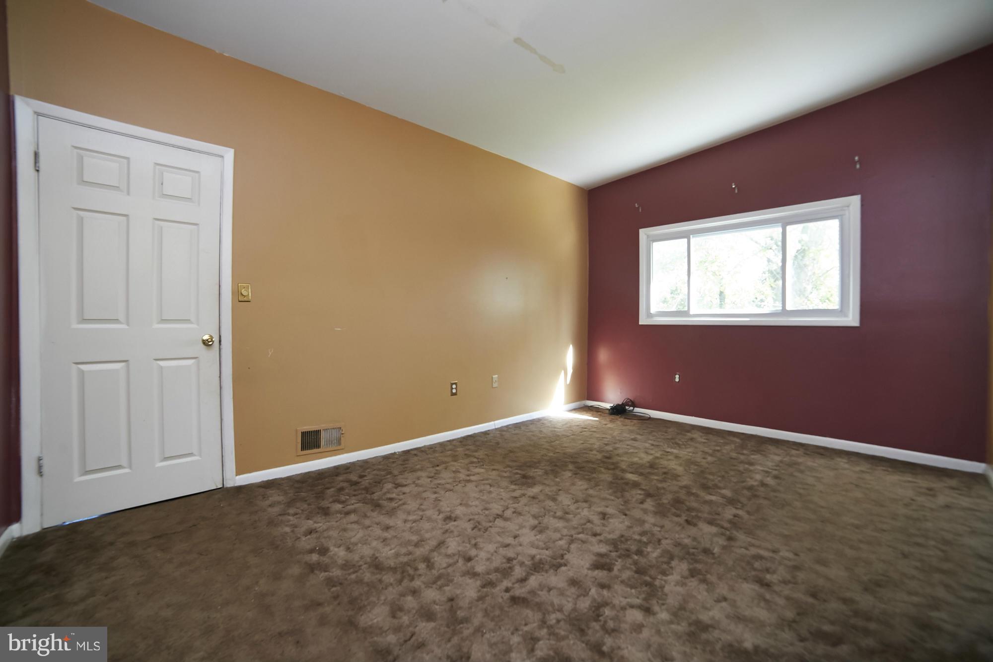 6851 Queens Ferry Road Baltimore, MD 21239 - Photo 15 of 25 an empty room with windows