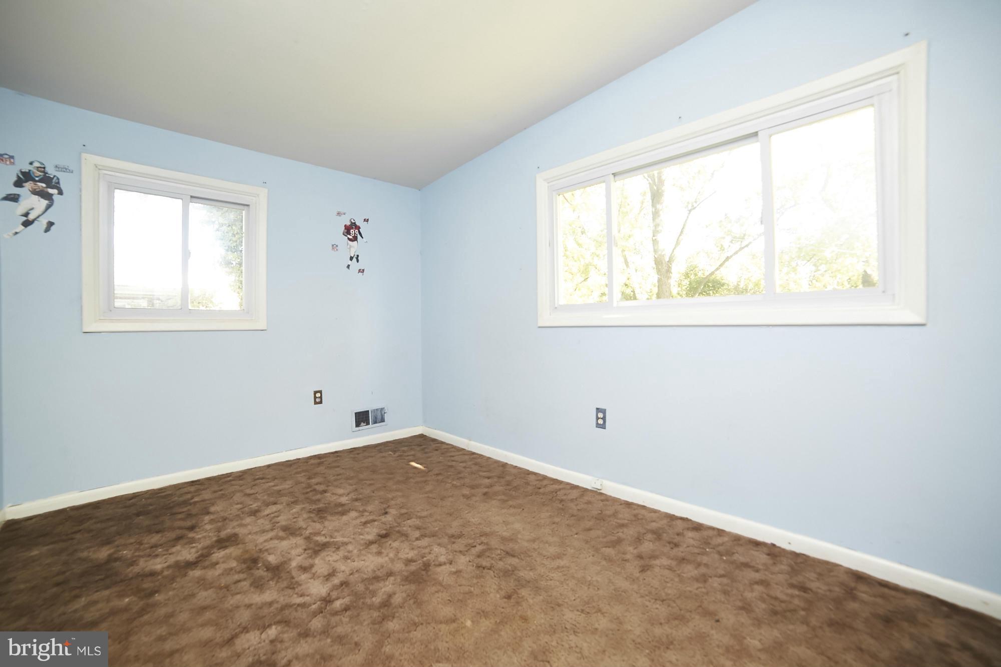 6851 Queens Ferry Road Baltimore, MD 21239 - Photo 17 of 25 an empty room with a window