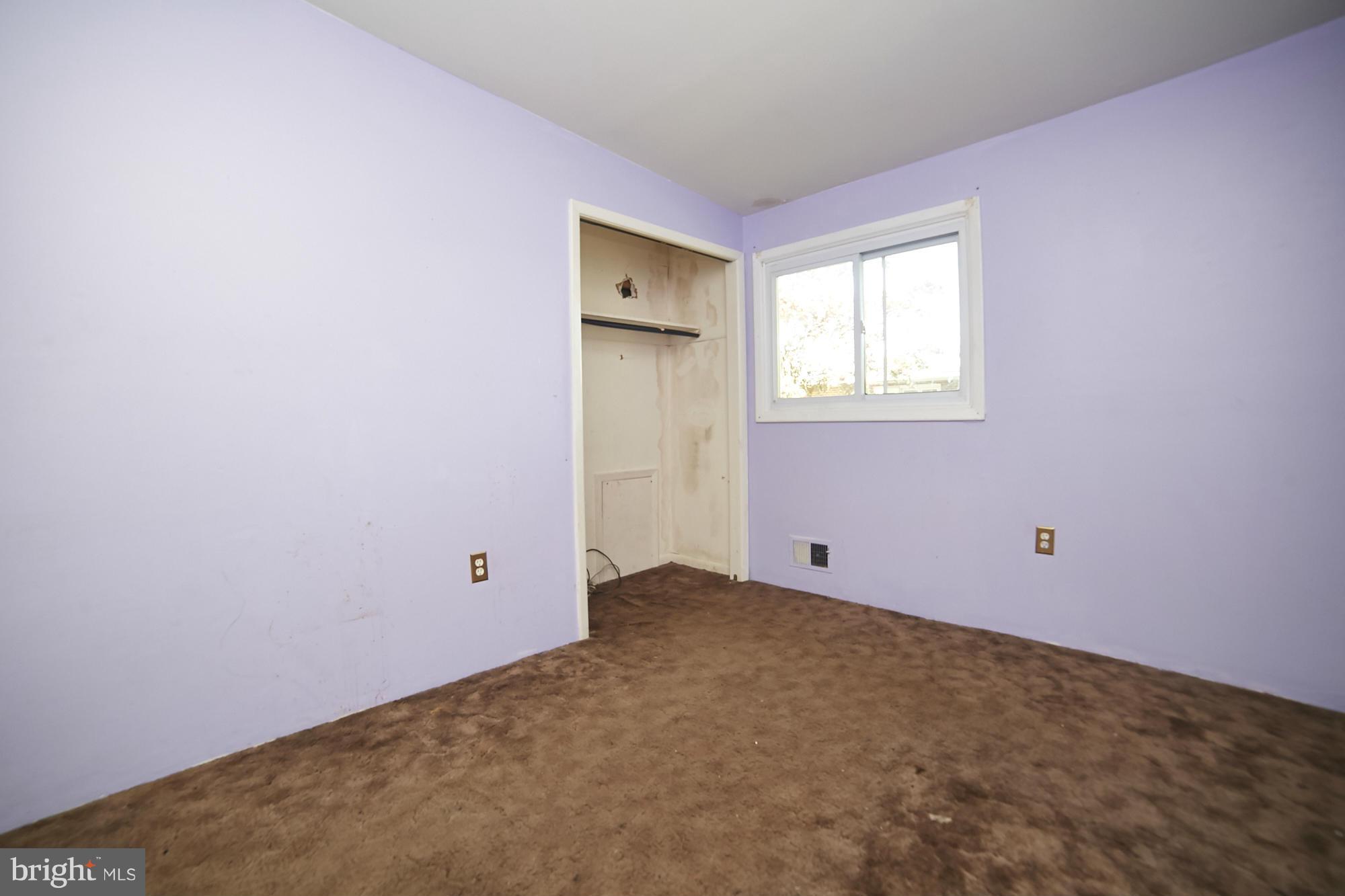 6851 Queens Ferry Road Baltimore, MD 21239 - Photo 18 of 25 an empty room with a window