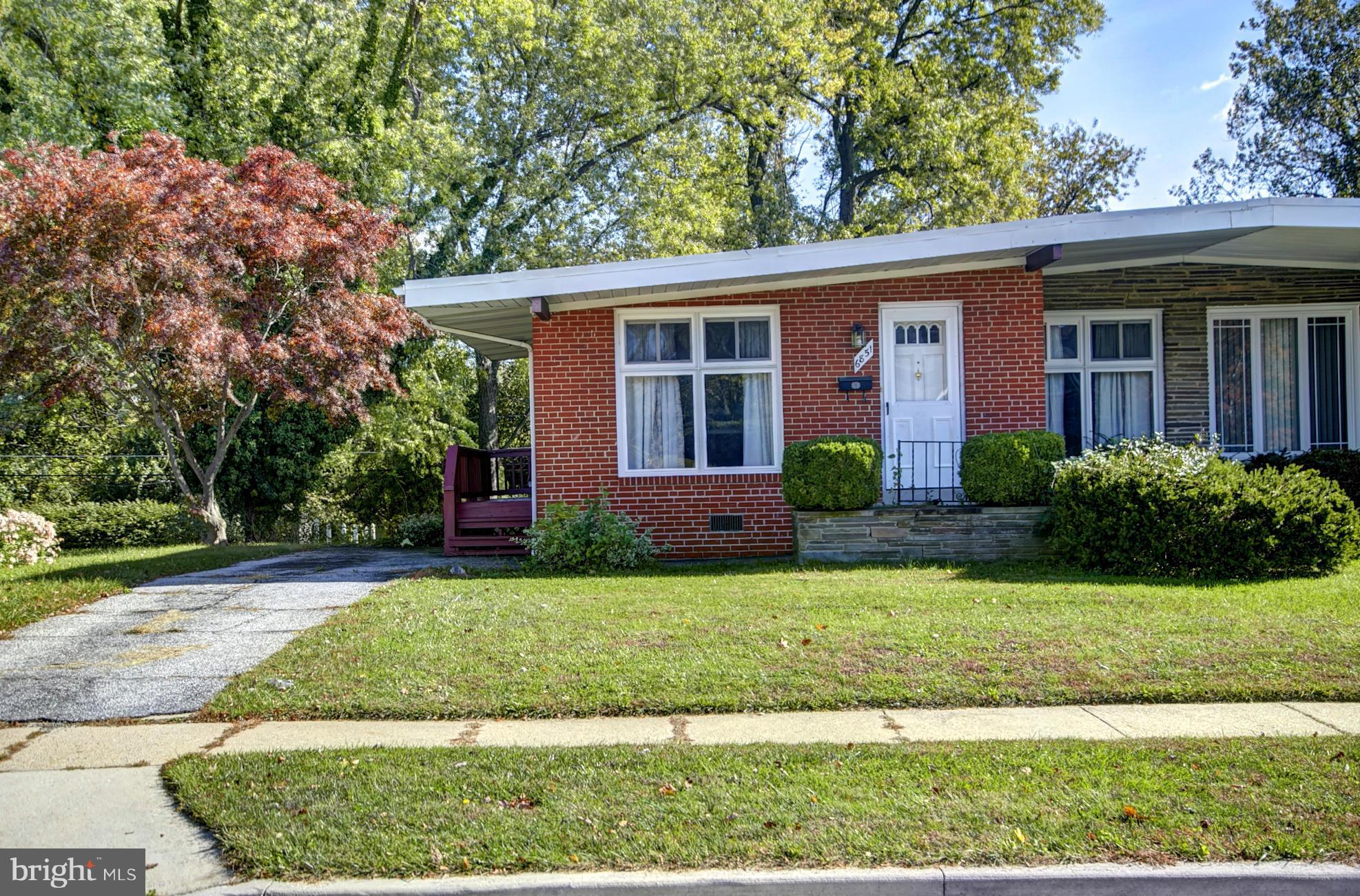 6851 Queens Ferry Road Baltimore, MD 21239 - Photo 2 of 25 a view of a house with a yard