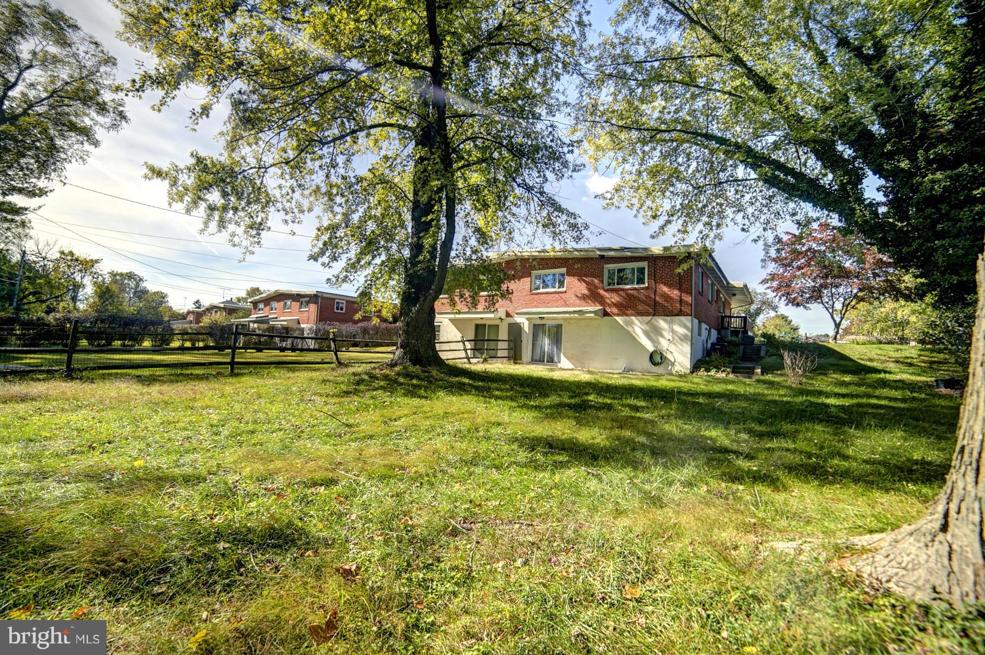 6851 Queens Ferry Road Baltimore, MD 21239 - Photo 25 of 25 a view of a house with a yard