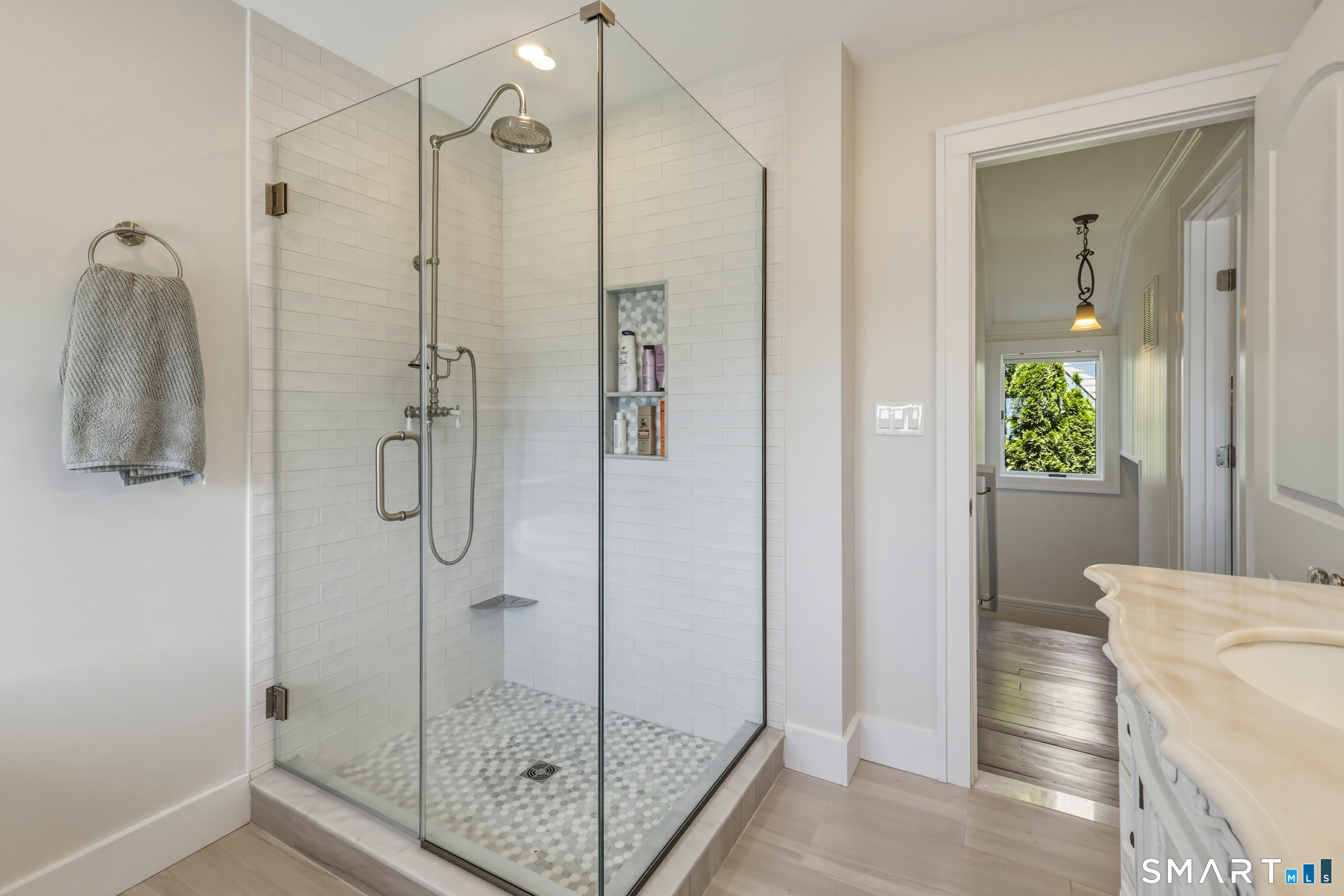 31 Sols Point Road Clinton, CT 06413 - Photo 18 of 40 Beautifully remodeled full bath on the second floor featuring tile flooring, recessed lighting, soaking tub, and a separate tiled walk-in shower.