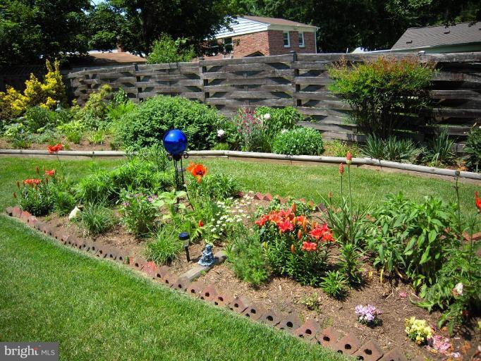 2715 Woodedge Road Silver Spring, MD 20906 - Photo 14 of 22 a view of a garden with large trees