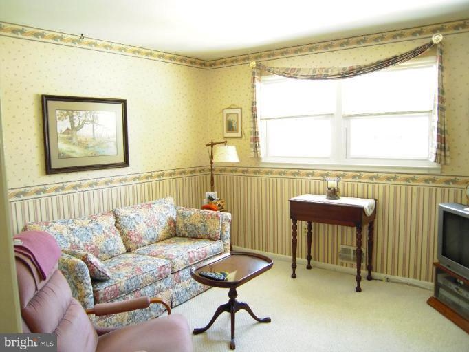 2715 Woodedge Road Silver Spring, MD 20906 - Photo 17 of 22 a living room with furniture and a window