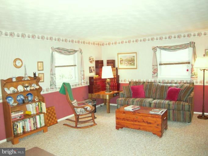 2715 Woodedge Road Silver Spring, MD 20906 - Photo 18 of 22 a living room with furniture and a large window