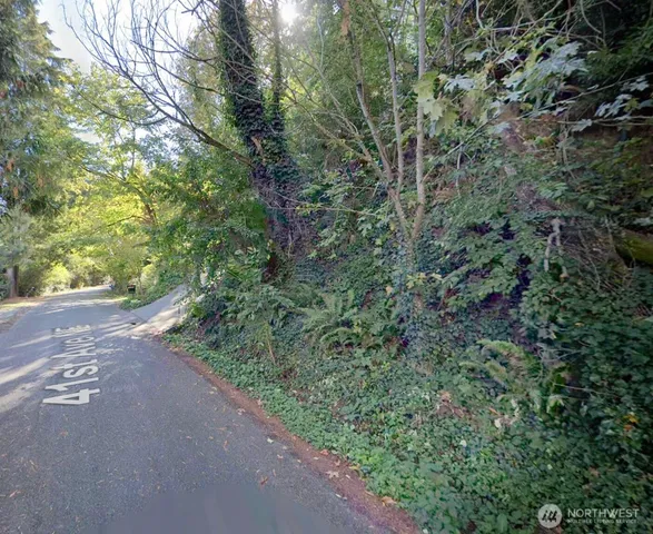 a view of a street with a trees