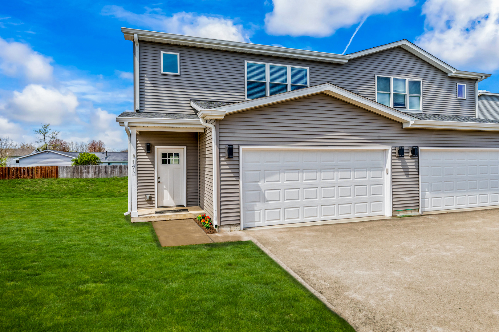 1314 8th Street, Unit 1314 Harvard, IL 60033 - Photo 10 of 19 a front view of a house with a garden