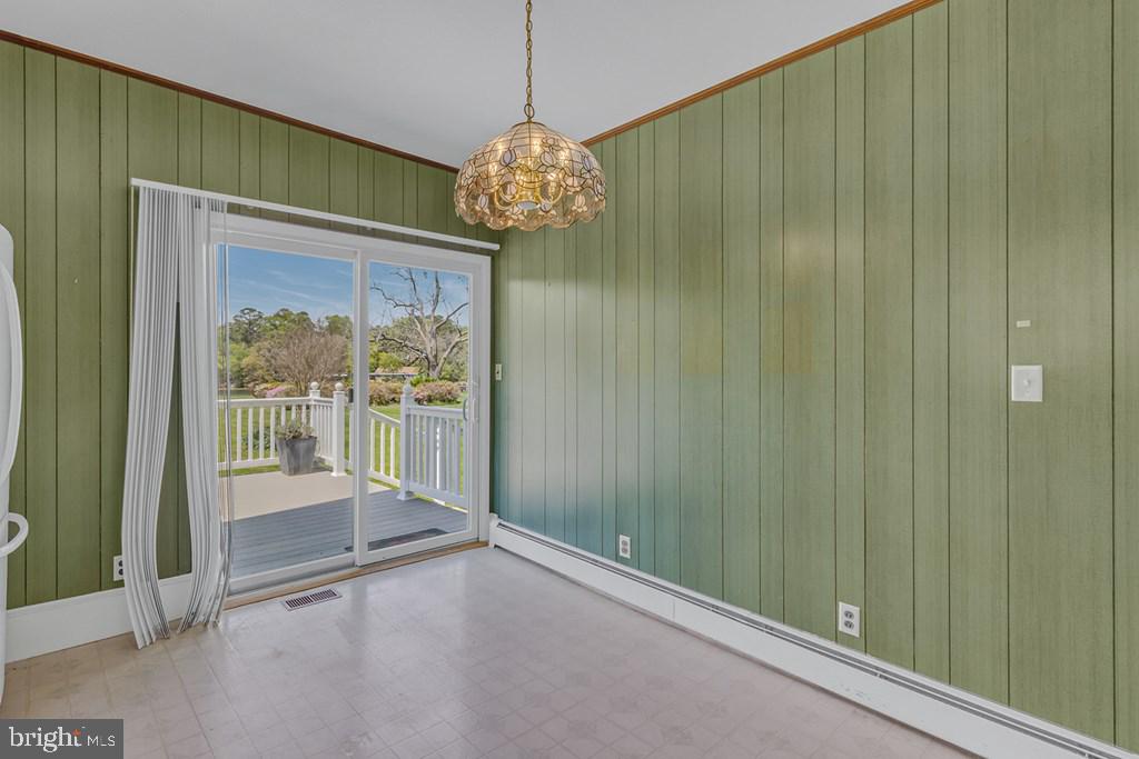 742 Main Street Reedville, VA 22539 - Photo 10 of 66 Charming dining space with garden view.