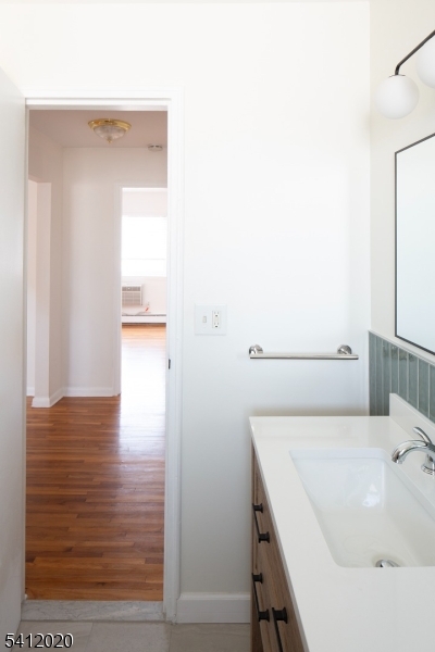 197 North Beverwyck Road, Unit 10 Lake Hiawatha, NJ 07034 - Photo 12 of 18 a bathroom with a sink and a mirror