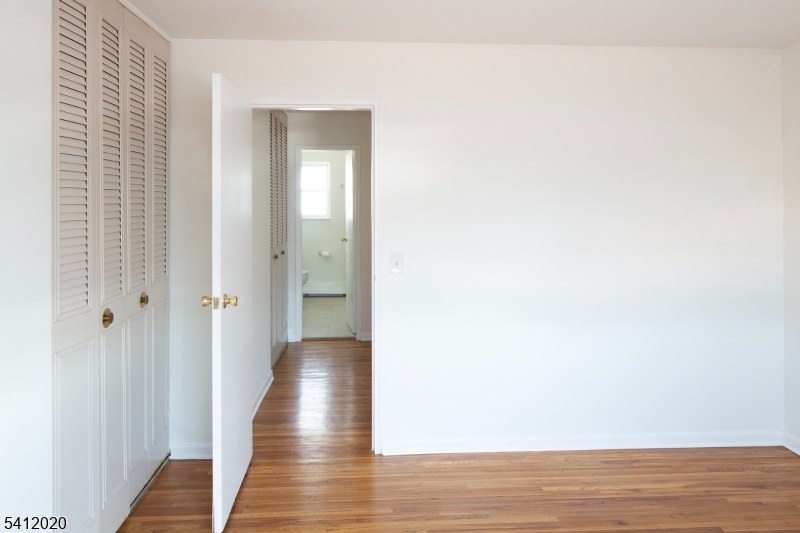 197 North Beverwyck Road, Unit 10 Lake Hiawatha, NJ 07034 - Photo 18 of 18 a view of a hallway with wooden floor