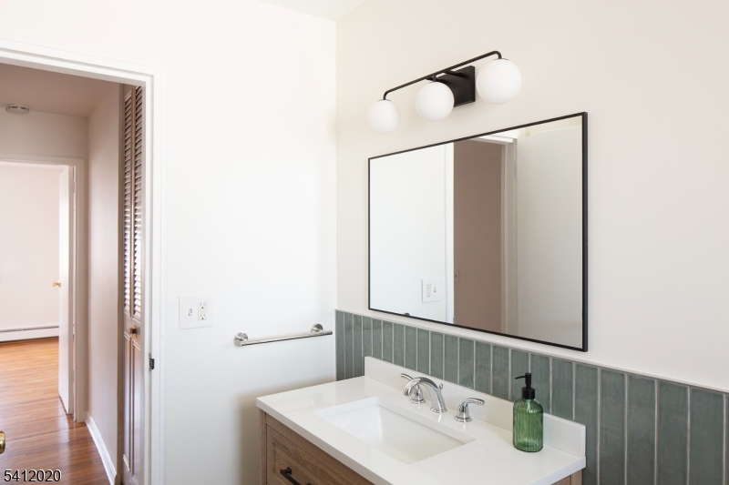 197 North Beverwyck Road, Unit 10 Lake Hiawatha, NJ 07034 - Photo 9 of 18 a bathroom with a sink and a mirror