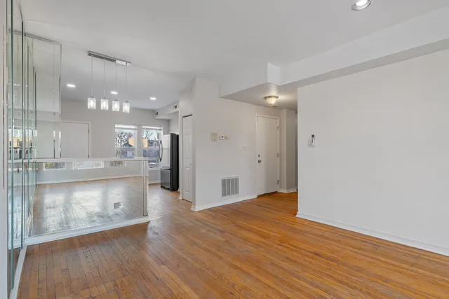 a view of a kitchen with a sink and a large window