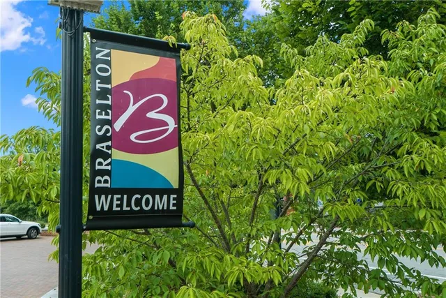 a backyard with plants and outdoor seating