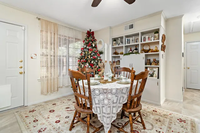 a dining room with furniture and window