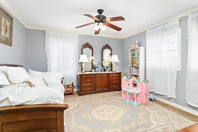 a bed room with a bed and a chair