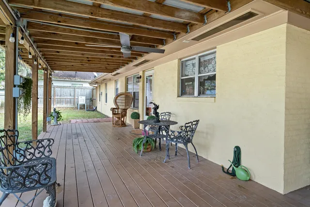 a dining room with wooden floors and wooden furniture