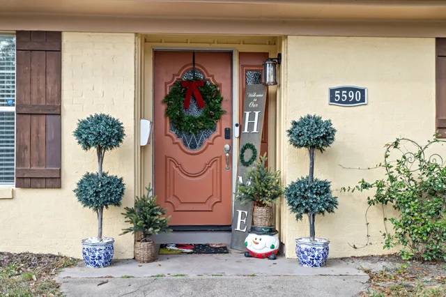 a front view of a house with garden