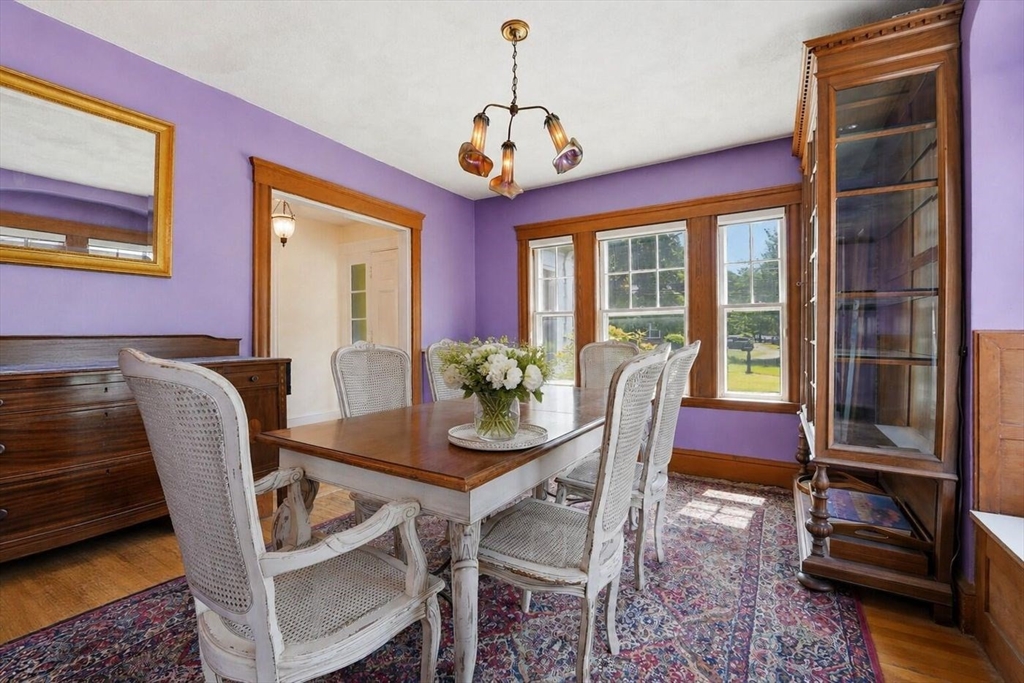 19 Humphrey Street Marblehead, MA 01945 - Photo 11 of 29 a dining room with furniture a rug and a chandelier