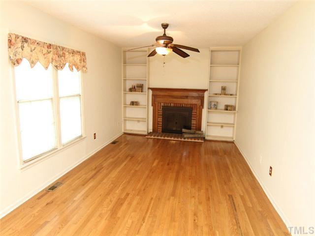 809 Carpenter Fletcher Road Durham, NC 27713 - Photo 3 of 14 Cozy den that sports a true masonry wood burning fireplace. Don't miss the convenient bookshelves. Den/Family/Great Room