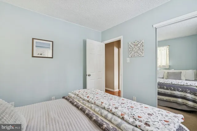 a bedroom with a bed and a cabinets