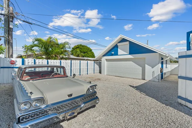 a living room with furniture a flat screen tv and a couch