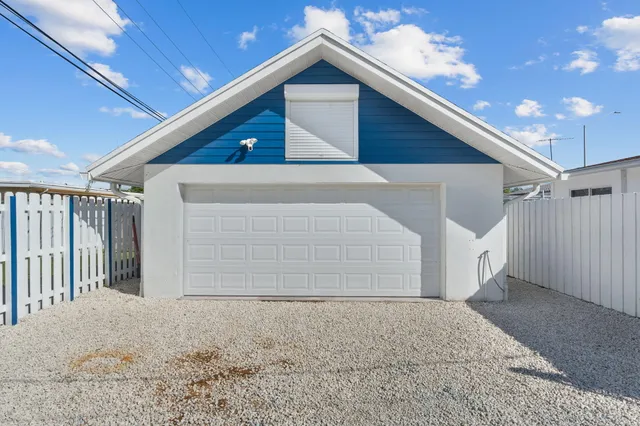 a living room with furniture a rug and a chandelier