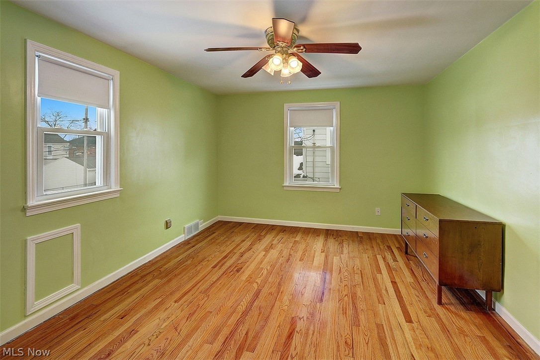 4457 Groveland Road University Heights, OH 44118 - Photo 18 of 24 The second bedroom on the second floor has wood floors, ceiling fan, and measures 14 x 11.