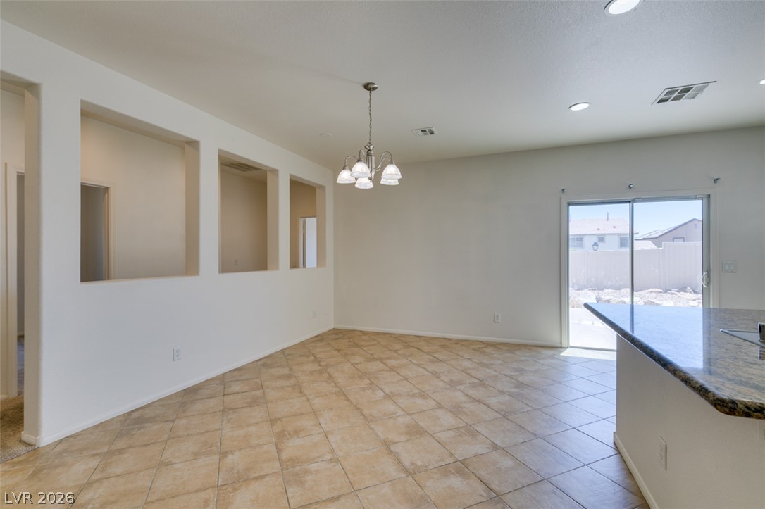 5150 Riverside Run Court North Las Vegas, NV 89081 - Photo 17 of 50 A well-lit area provides direct patio access, perfect for indoor-outdoor living.